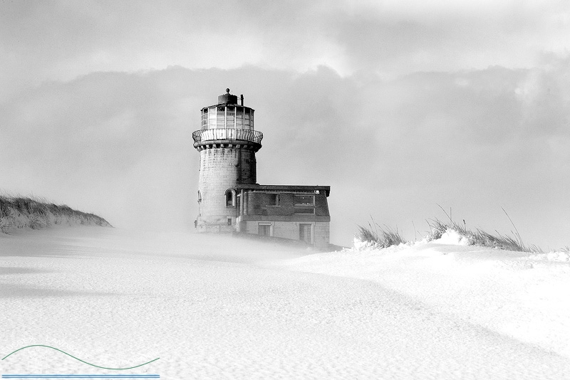 slides/Snow Blown.jpg winter sussex east snow coast beachy head lighthouse eastbourne rocks water ocean people person clouds storm cliffs pebbles red white blue Snow Blown